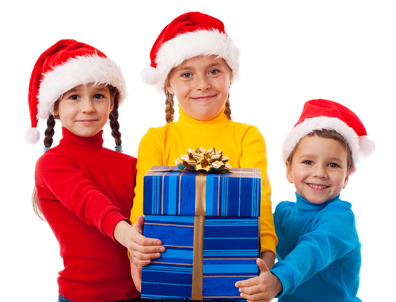 Three smiling kids with Christmas gift